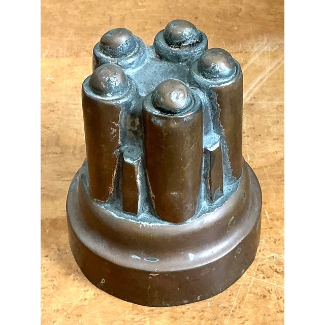 This antique copper over tin jelly mold is a beautiful example of traditional culinary craftsmanship from the late 19th to...