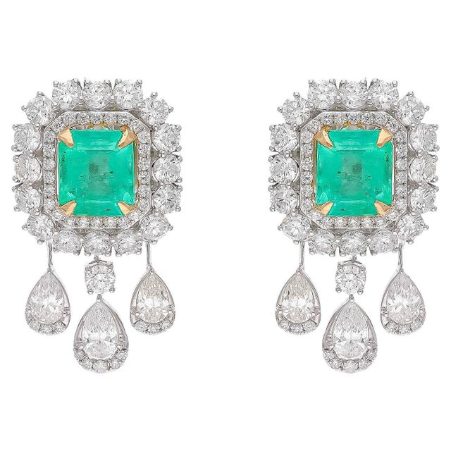 Diamonds : 4.35 carats Emerald : 4.02 carats Gold : 9.23 gm( 18k) This is a beautiful earrings with very high quality...