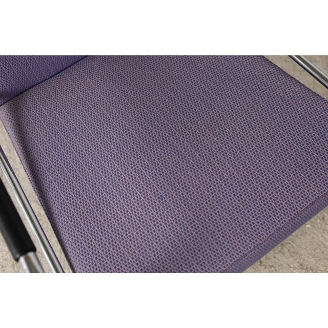 Gunilla Allard Cinema Chairs by Lammhults. Chrome frames with black leather wrapped arms. Purple upholstery that may be...