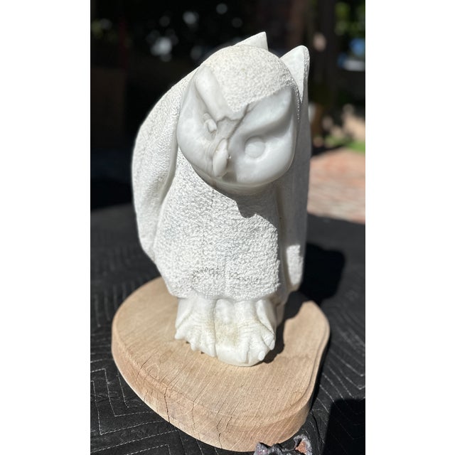 A substantial hand-carved marble owl sculpture by listed Taos, New Mexico artist Frank McGuire (b. 1938), whose work...