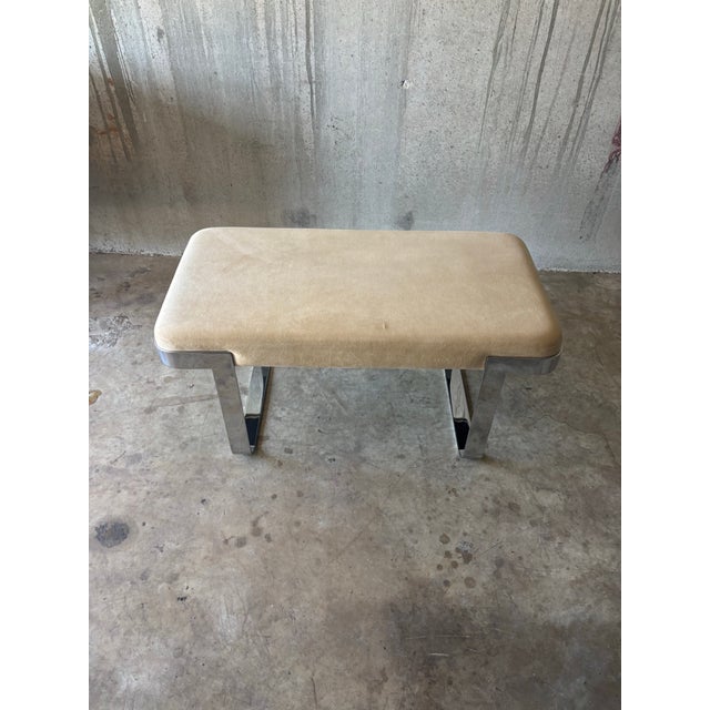 A vintage mid century modern bench by Trimark, featuring a polished chrome base with a clean architectural profile. The...