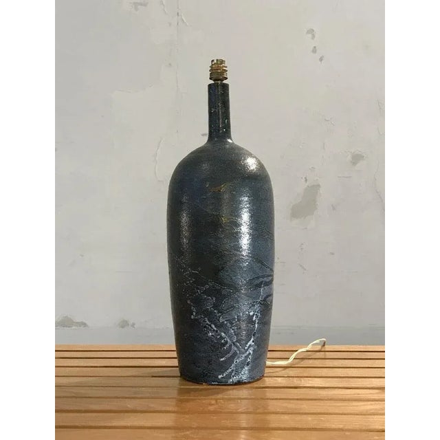 A very large table or floor lamp, art-deco, neo-classical, modernist, bauhaus, free form, in thick blue enameled ceramic...