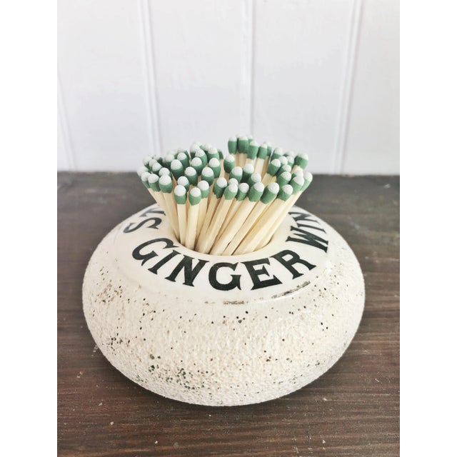 An antique English stoneware match strike, made to be used in a pub to advertise ginger wine. In excellent condition for...