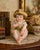 A charming vintage French porcelain “Piano Baby” figurine attributed to renowned porcelain maker Camille Naudot. This...