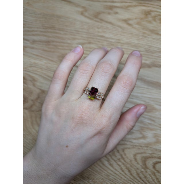 A 2.6ct bi-color tourmaline flashing two moods at once, set in solid 14K gold with natural diamond sparkle. Soft shift,...