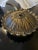 Three light brass sconce with opaque glass shades. Unique flower petal round base Sconce measures 20” across Can be...