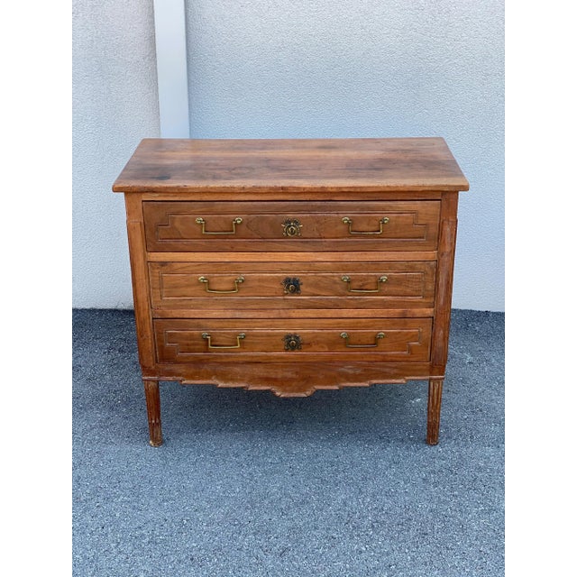 This is a beautiful vintage three drawer wooden chest. The front of the chest has wonderful details like the brass pulls...