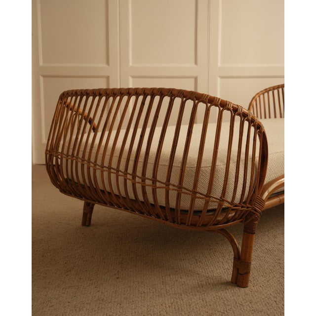 Italian production 1960s Daybed Bamboo and bent wicker frame; upholstered seat covered in a beige fabric.