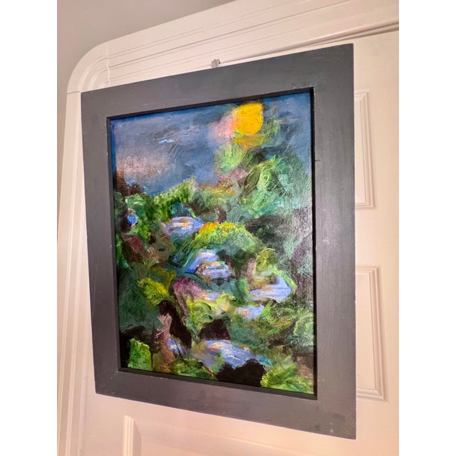 This evocative landscape captures the quiet mystery of a moonlit night, with a luminous golden moon suspended above richly...