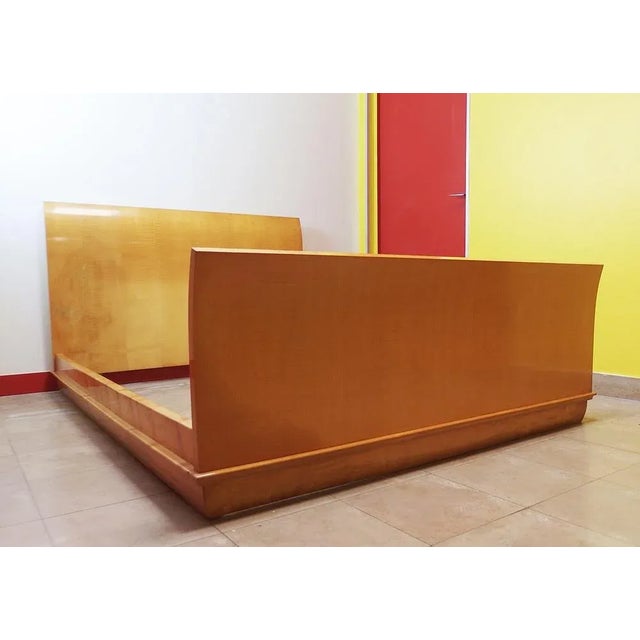 Art Deco bed with curved head and foot, placed with sycecore tackle strips, base of the curved bed inward. Height of the...