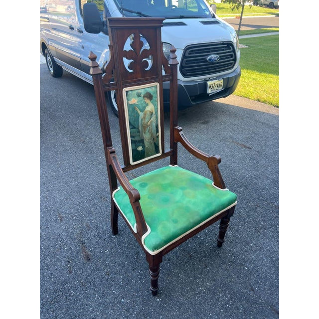 An impressive high-back armchair blending Gothic Revival structural elements—such as carved tracery, trefoil cutouts, and...
