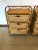 East Hampton-ish pair of natural rattan and wicker night stands having 3 drawers in each. Height to top surface is 28"; 32...