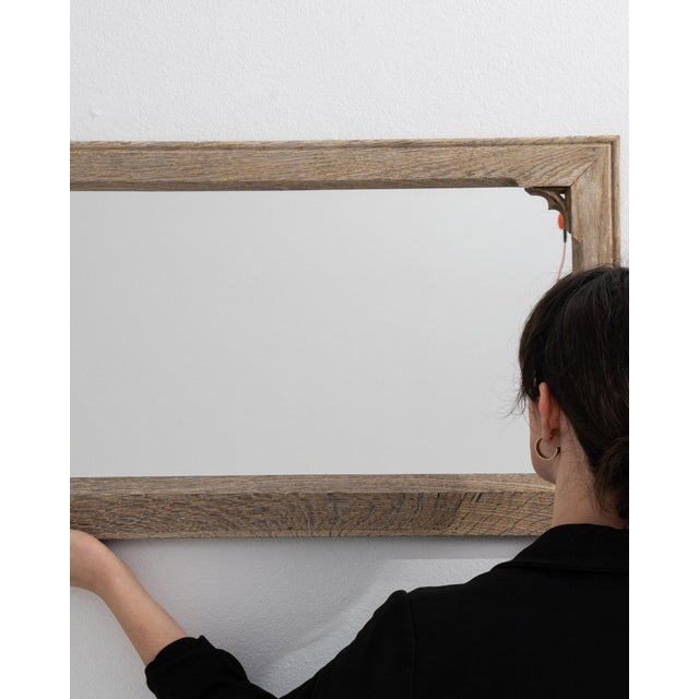 This mirror makes its impression through natural weathered oak frame, rectangular. Originating in France during 1900s, it...