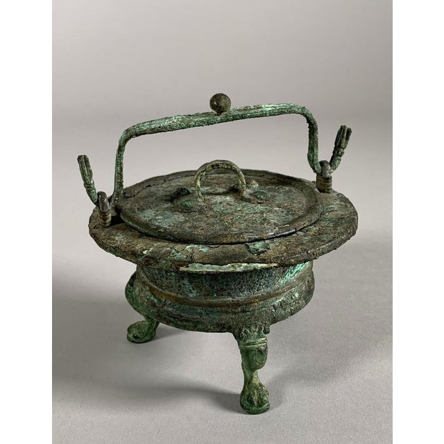 Bronze Vessel, Ancient Roman Period, 1st-2nd Century AD Ritual vessel used for cooking sacrificial offerings. Rests on a...