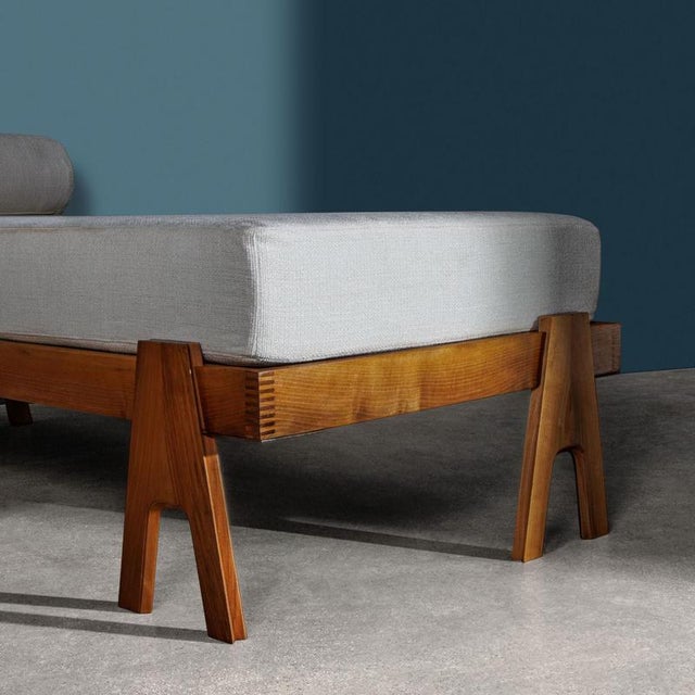 A three-legged teak daybed made circa 1955 by Mascheroni based on a patented design by architects Angelo Mangiarotti and...