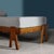A three-legged teak daybed made circa 1955 by Mascheroni based on a patented design by architects Angelo Mangiarotti and...