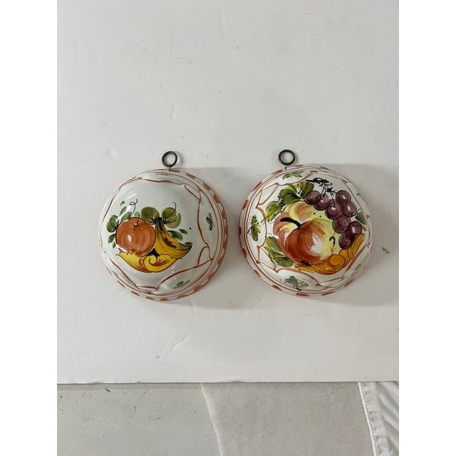 Vintage Bassano hand painted fruit pattern ceramic molds. Hangers attached for easy wall mount. 5.5” diameter x 3” h.