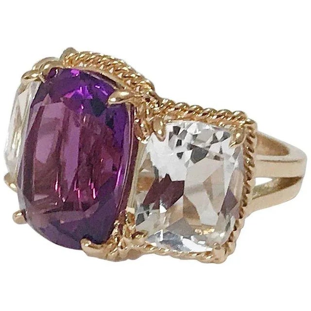 Christina Addison Elegant 18kt Yellow Three Stone Ring with Rope Twist Border with split shank detail. The ring features...