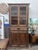 Tall antique French Walnut Cabinet. Note: one pane of glass is missing. Dimensions Base - 43” wide 44” wide crown 92” high...
