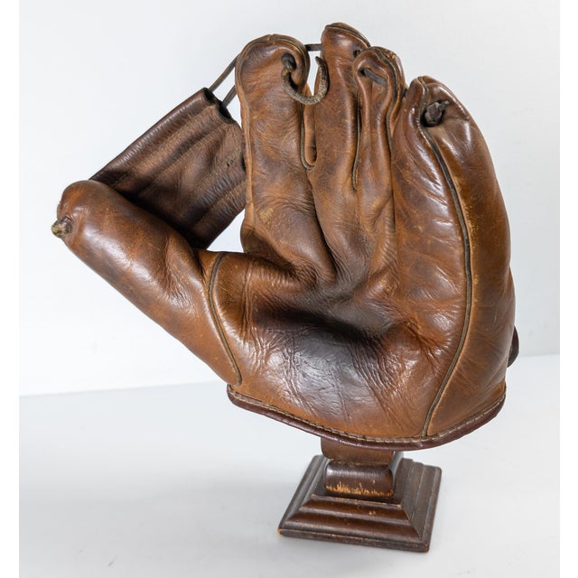 We are selling this cool baseball glove on a display stand. This leather fielder’s mitt is from the Pre-WWII era circa...