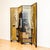 A vintage four-panel folding screen or room divider combining Hollywood Regency glamour with Chinoiserie and Neoclassical...