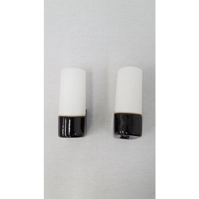 Rare pair of black wall lamps 6063 - Wilhelm Wagenfeld for Lindner leuchten Pair of black ceramic bathroom lamps with an...