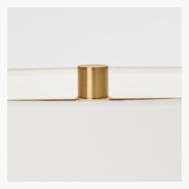 The Aura table lamp by Hable features a unique two-legged design, providing a modern twist on traditional table lamps. The...