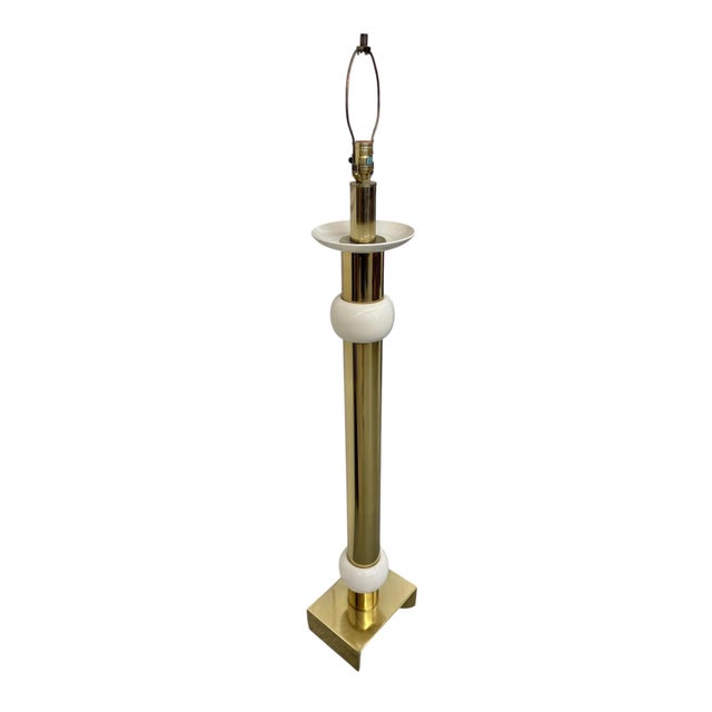 Elevate your space with this striking Mid-Century Modern brass floor lamp, dating to the 1970s and inspired by the iconic...