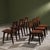 This set of six dining chairs by Jens Risom, made in the 1940s–1950s, features a frame in dark-stained solid oak with...