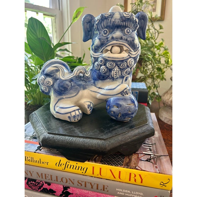 This vintage Chinese porcelain foo dog, or guardian lion, is done in classic blue and white with wonderfully expressive...