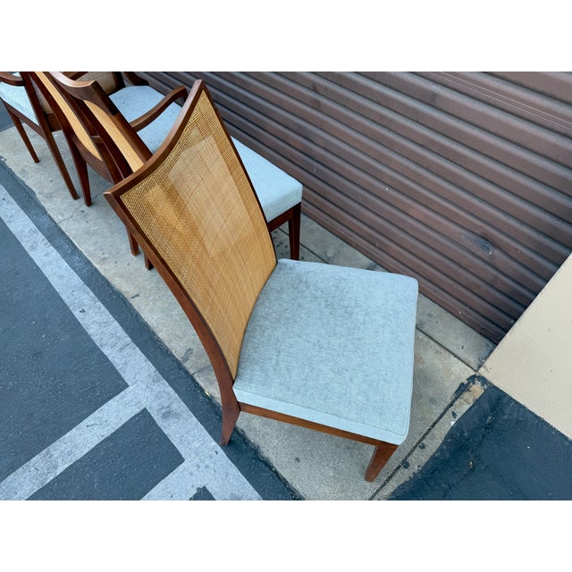 Rare set of Glenn of California high cane back dining chairs with 2 captains chairs. This set came right out of the estate...