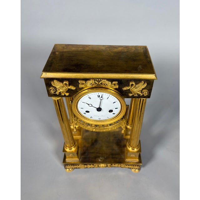 Empire period portico clock French work, circa 1800. The clock is in the form of a portico framed by four antique-style...