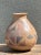 This vintage vase channels a Mid-Century Modern sensibility through a striking hand-painted geometric motif, crafted...