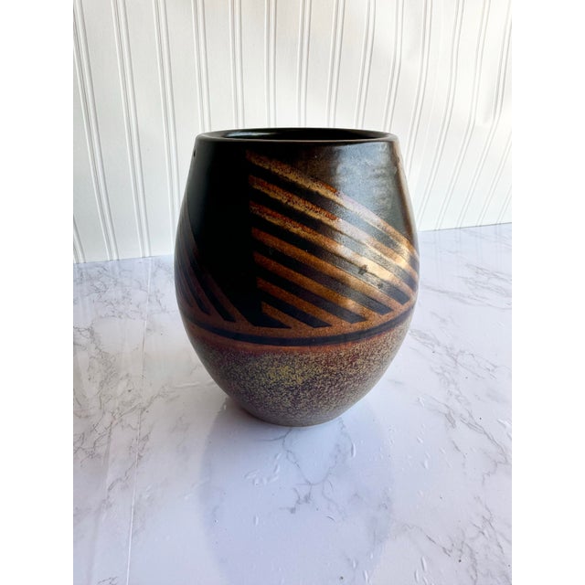 This beautiful signed (possibly Dawn?) studio pottery vase showcases a rich earthy brown and lighter brown glaze, accented...