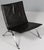 Poul Kjærholm lounge chair in patinated black ful grain aniline leather. Frame of brushed steel. Model PK22, made by Fritz...