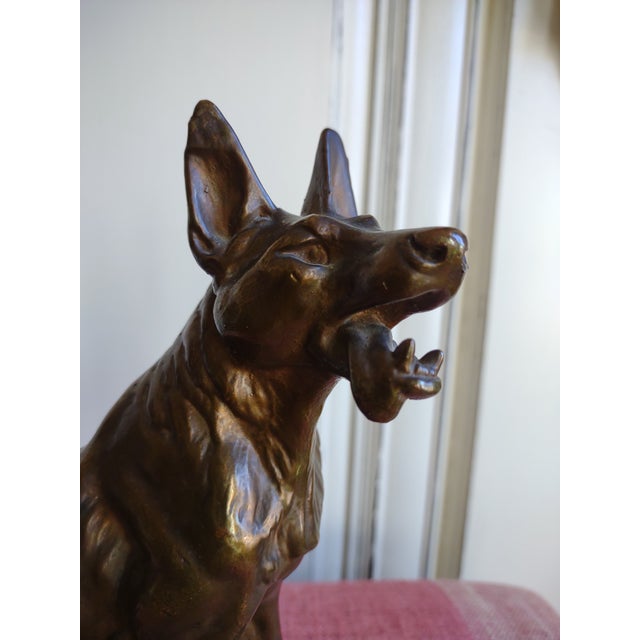 Offered is a large German Shepard dog statue. It measures 9" tall by 8 1/2" across. It is heavy weighing almost 4 pounds....