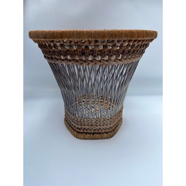 A single antique woven wicker cachepot basket.