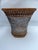 A single antique woven wicker cachepot basket.