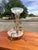 An exquisite vintage epergne showcasing romantic Venetian and Hollywood Regency influences, this sculptural centerpiece...