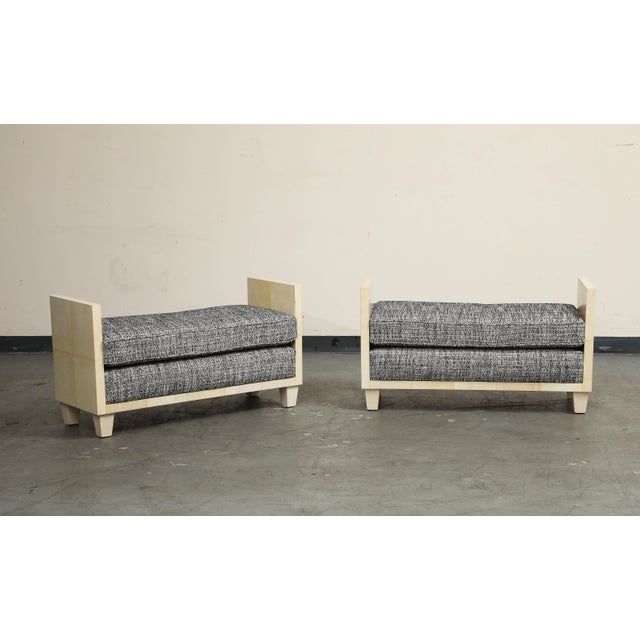 A contemporary 21st century pair of parchment benches in the style of Jean Michel Frank. Handsome midcentury silhouette...