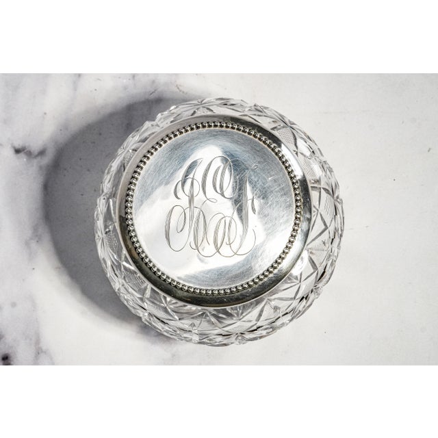 This beautiful circa 1915 cut crystal powder jar is a refined example of early twentieth-century vanity ware, combining...