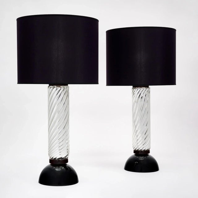 Murano mercury glass spiral lamps from Italy. This hand-blown pair of “vetro specchiato” mercury glass lamps have a black...