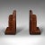 This is a vintage pair of decorative bookends. An English, walnut book rest by Gordon Russell Limited, dating to the early...