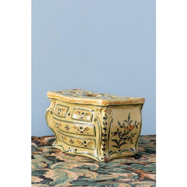 A rare 18th-century French faience bough pot from Nevers, modelled in the playful form of a commode. Complete with finely...