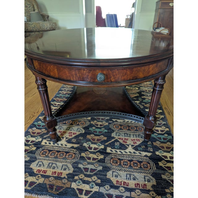 Theodore Alexander Living Room The Galleried Cocktail Table Description: An flame veneered, burl veneer inlaid and...