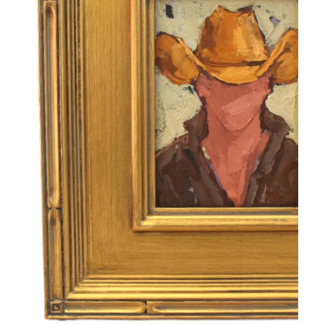 Impressionist oil painting on an artist's hardboard panel of a western cowboy with a hat displayed in a complementary...