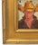 Impressionist oil painting on an artist's hardboard panel of a western cowboy with a hat displayed in a complementary...