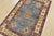 A tribal Caucasian Kazak rug hand-knotted with an all-wool pile on a cotton foundation. This oriental rug features a...