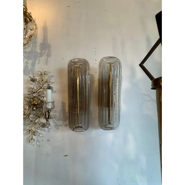 These modern Murano glass and brass sconces are a stylish addition to any room. The combination of the textured glass and...