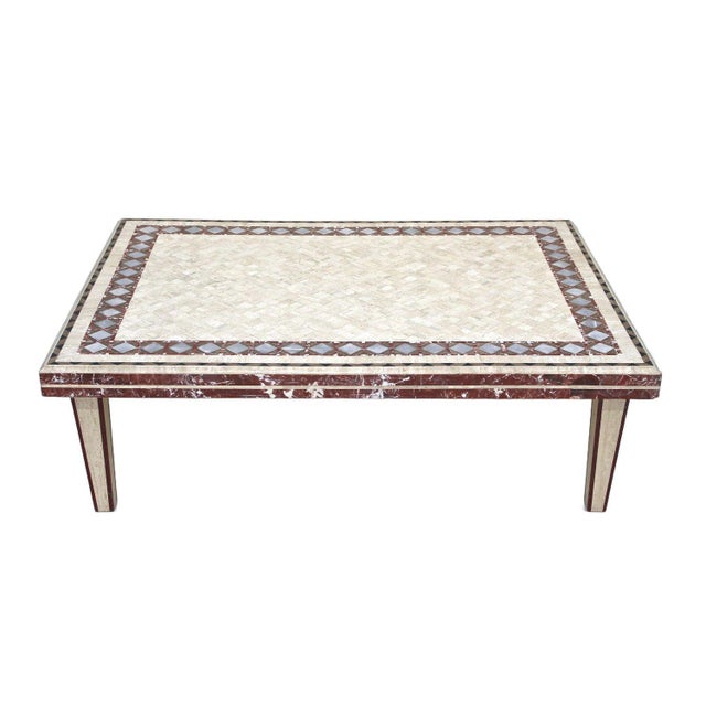 Elaborately handcrafted, custom made Italian travertine/ marble covered coffee/ couch table dating back to the 1980s. This...